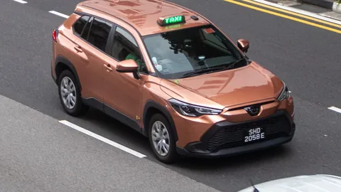 Prime Taxi copper Toyota Corolla Cross SUV
