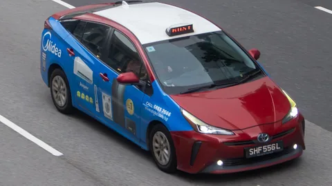 Trans-Cab Toyota Prius wrapped in a Midea air-conditioner ad